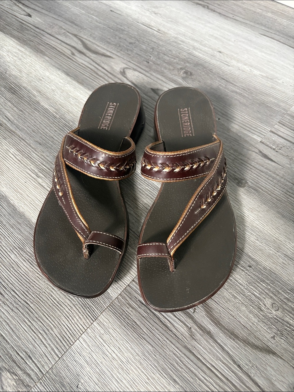 Women’s Stoneridge brand wedge sandals featuring whipstitch detailing.